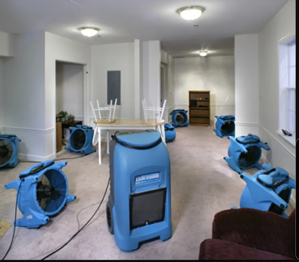 Air movers and dehumidifier setup for Water Damage Restoration in German Flatts