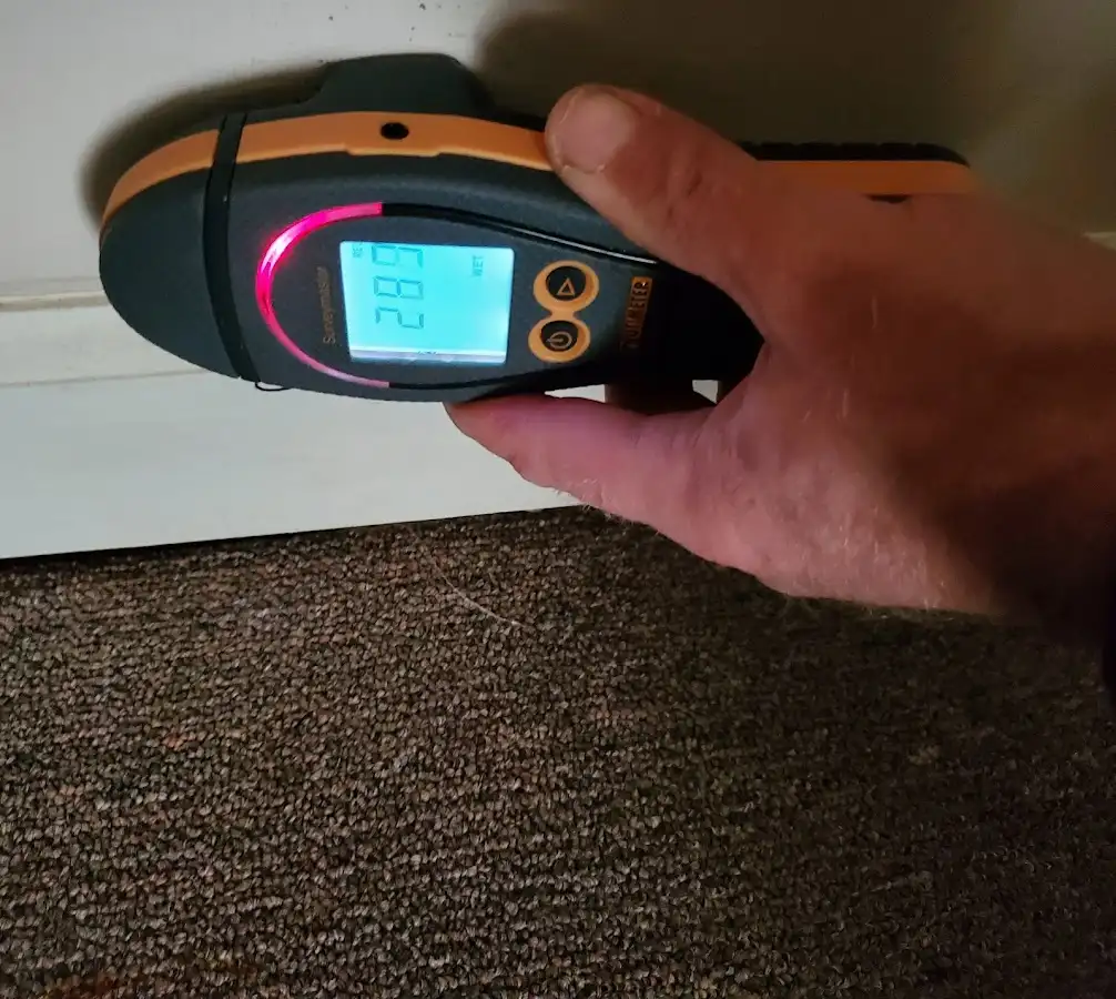 Moisture detection at baseboard during Storm Damage Restoration in German Flatts
